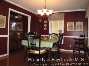 165 Cliff Road Southern Pines, NC 28387 - Photo 5 of 11 a dining room with furniture and chandelier