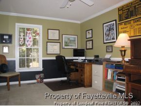165 Cliff Road Southern Pines, NC 28387 - Photo 6 of 11 a view of a livingroom with workspace and a window