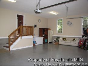 165 Cliff Road Southern Pines, NC 28387 - Photo 7 of 11 a living room with furniture and a flat screen tv