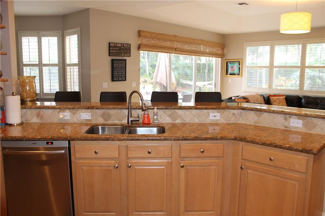 21491 Halstead Drive Boca Raton, FL 33428 - Photo 30 of 35 a kitchen with granite countertop a sink and a window