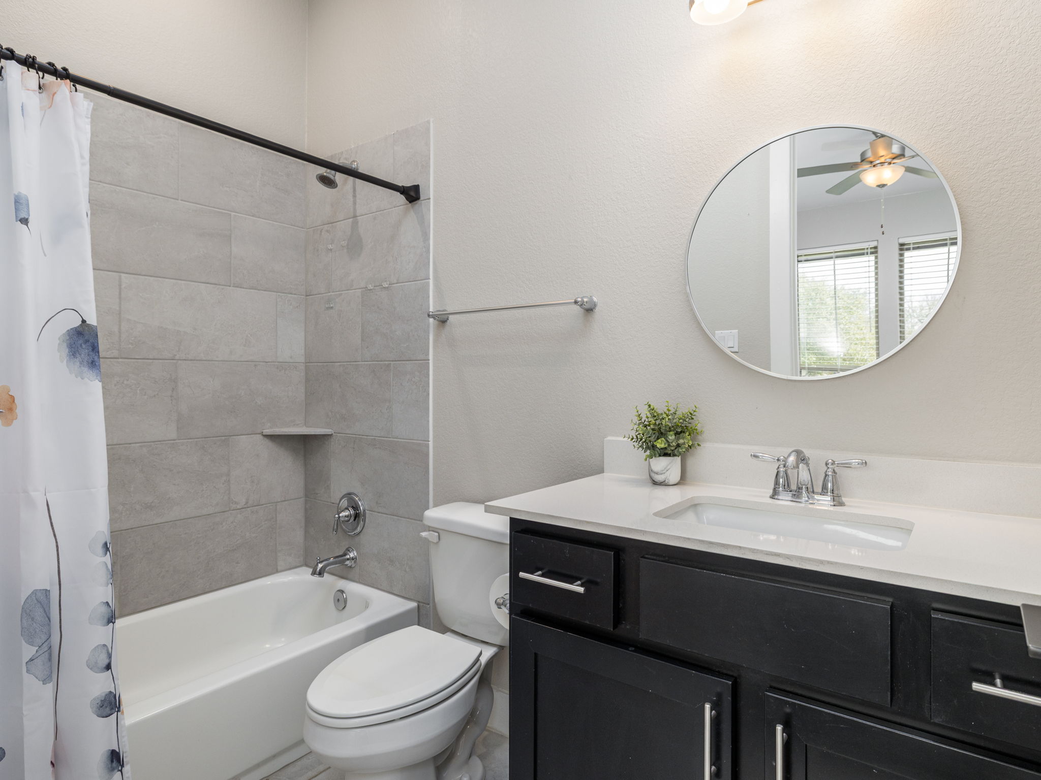 901 Clark Cove Road Buda, TX 78610 - Photo 16 of 37 Full bath featuring shower / tub combo, vanity, and ceiling fan