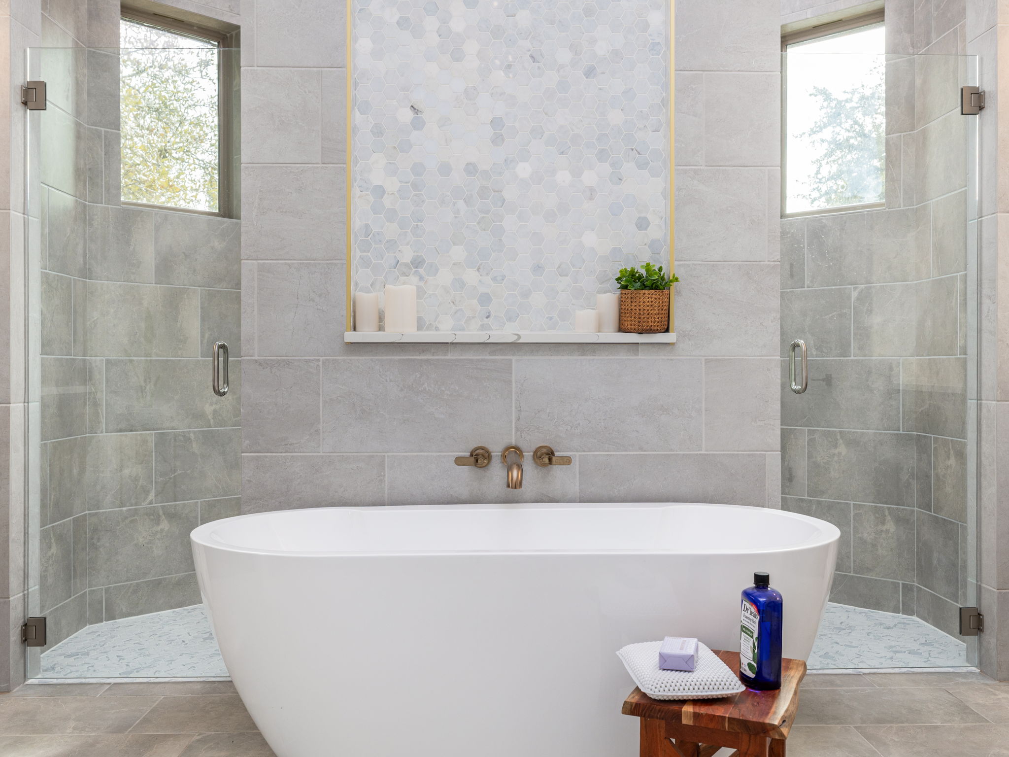 901 Clark Cove Road Buda, TX 78610 - Photo 18 of 37 Bathroom with a shower stall, a soaking tub, and tile walls