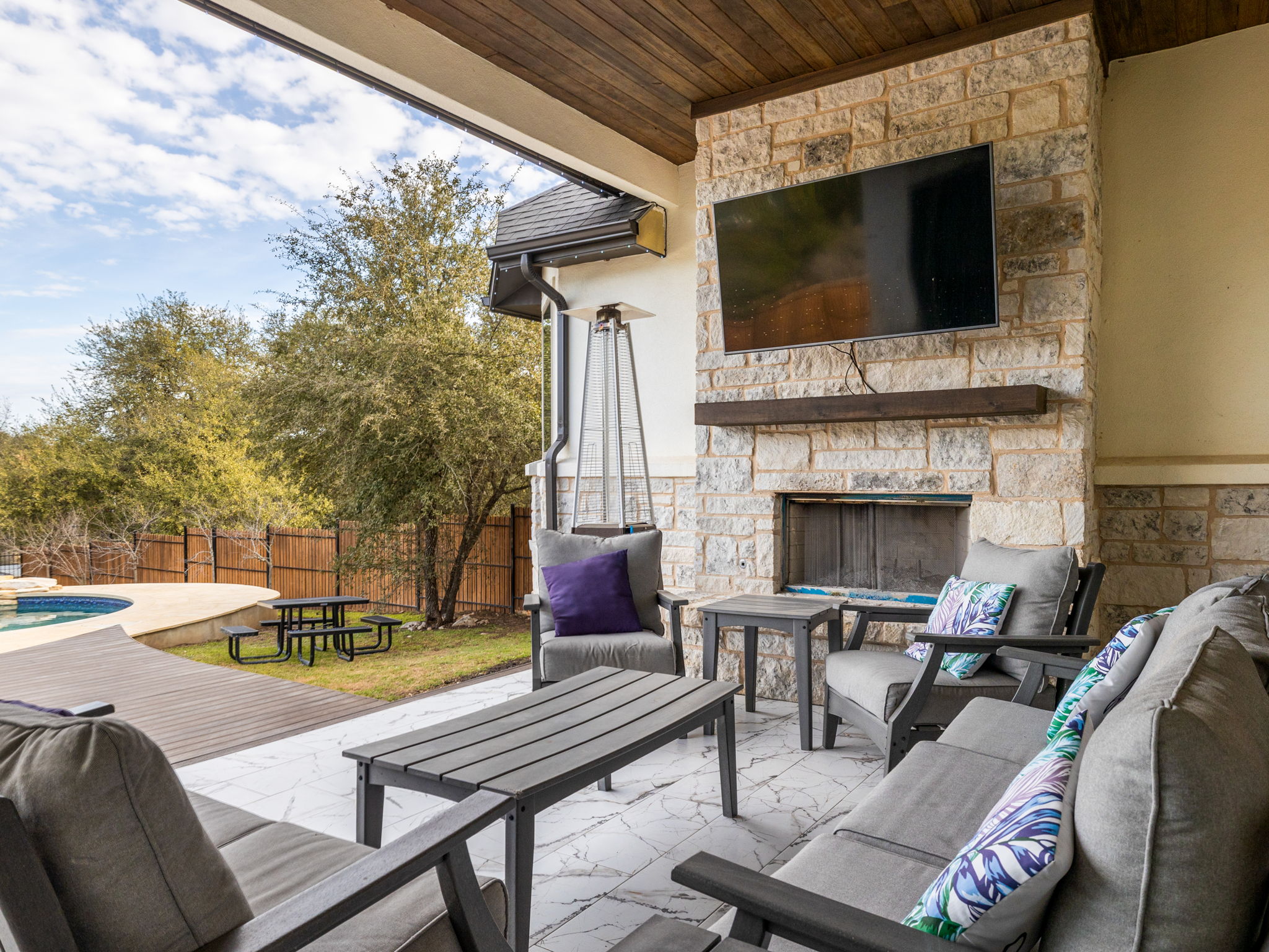 901 Clark Cove Road Buda, TX 78610 - Photo 24 of 37 View of patio with an outdoor living space with a fireplace