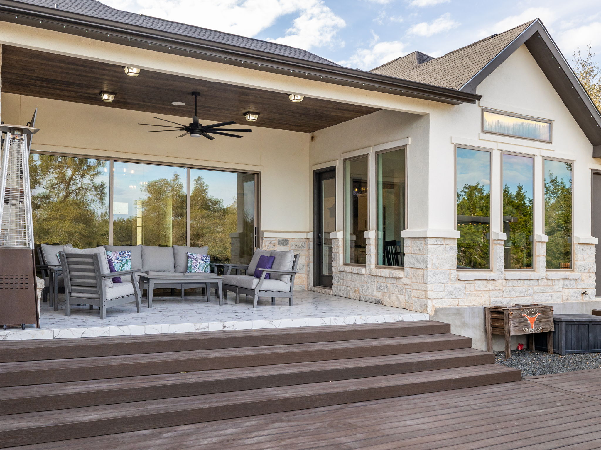901 Clark Cove Road Buda, TX 78610 - Photo 27 of 37 Wooden terrace with a ceiling fan and an outdoor hangout area