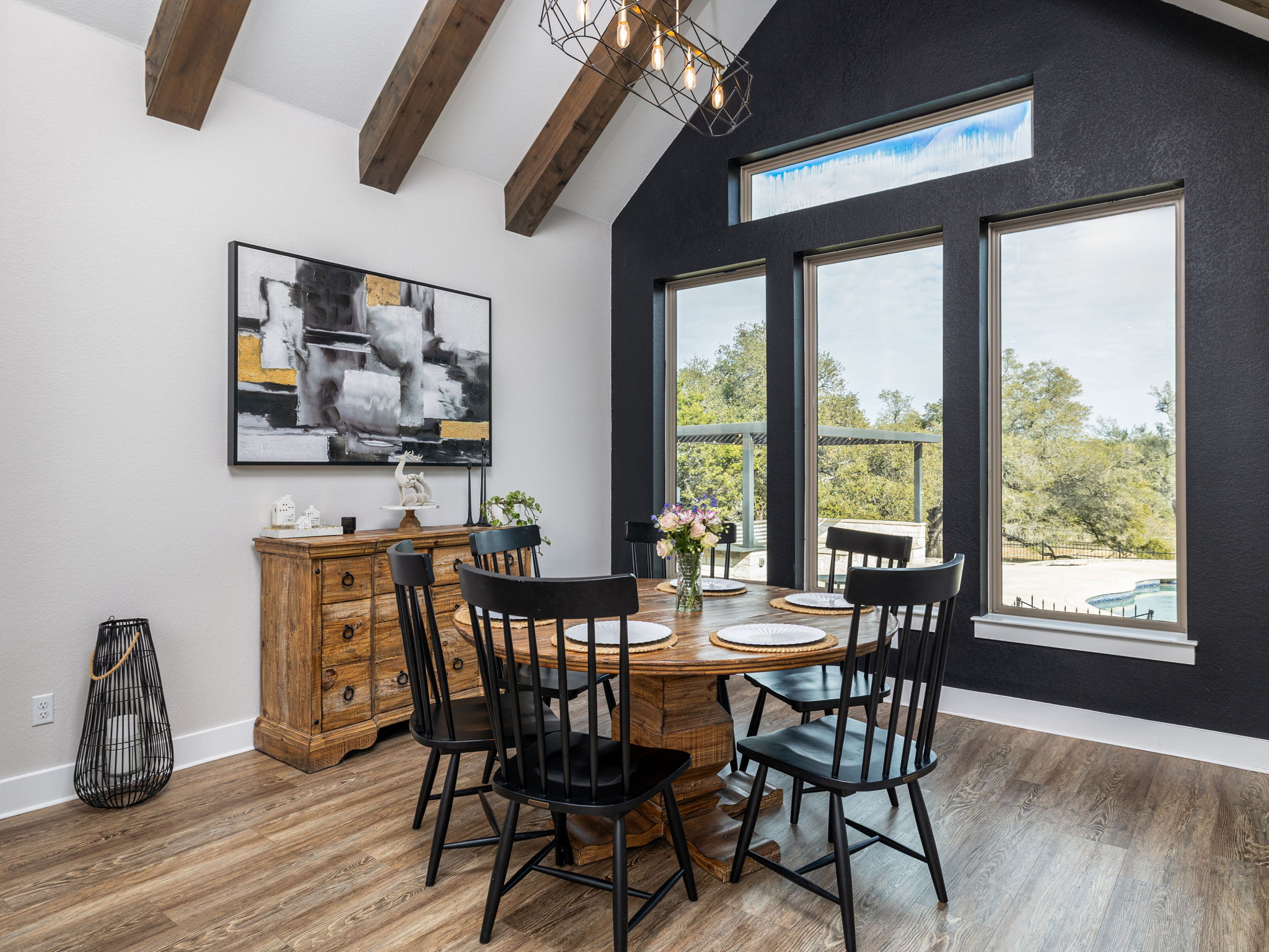 901 Clark Cove Road Buda, TX 78610 - Photo 5 of 37 Dining space featuring wood finished floors and suspended lighting