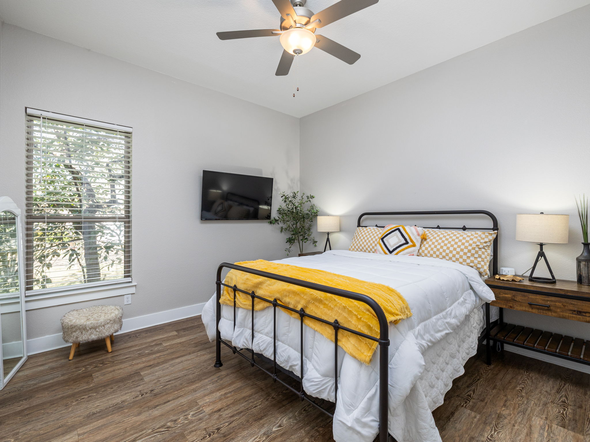 901 Clark Cove Road Buda, TX 78610 - Photo 9 of 37 Bedroom featuring ceiling fan and dark wood finished floors