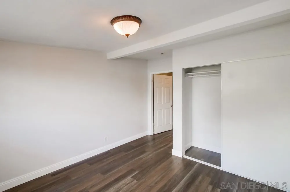 6327 Newsome Drive San Diego, CA 92115 - Photo 12 of 24 a view of an empty room with wooden floor