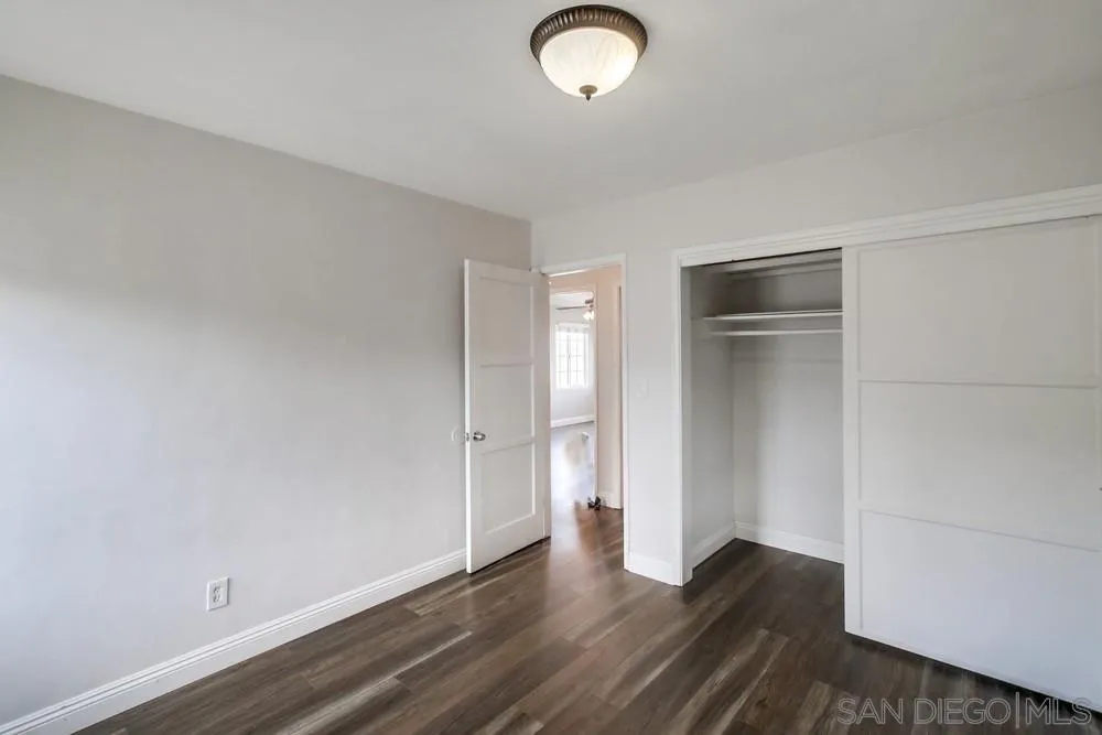 6327 Newsome Drive San Diego, CA 92115 - Photo 16 of 24 a view of empty room with wooden floor
