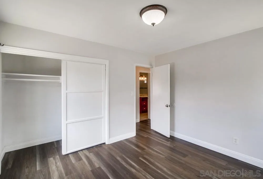6327 Newsome Drive San Diego, CA 92115 - Photo 20 of 24 a view of empty room with wooden floor
