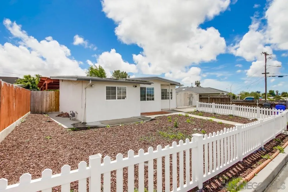 6327 Newsome Drive San Diego, CA 92115 - Photo 22 of 24 a view of a house with backyard and roof