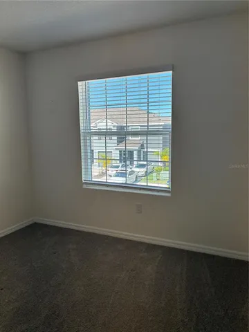 a view of a hallway with closet area