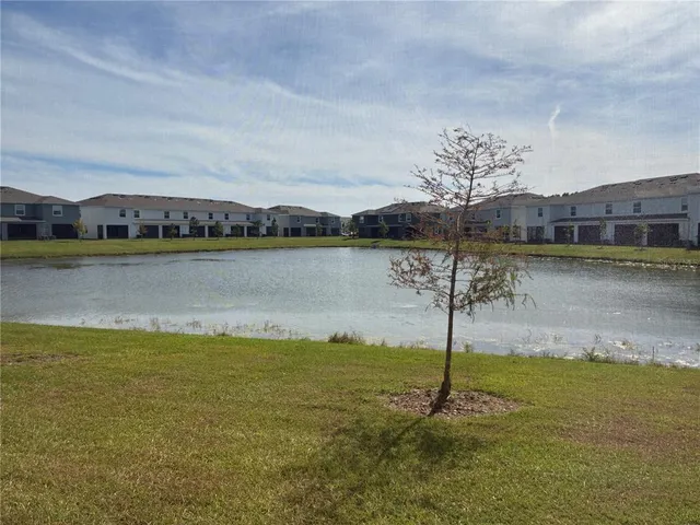 a view of a lake and a yard