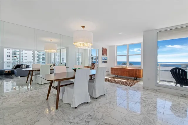 a living room with furniture a window and a table