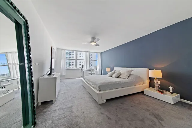 a spacious bedroom with a bed and a couch