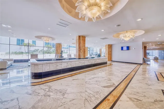 a view of kitchen and hall with a large window