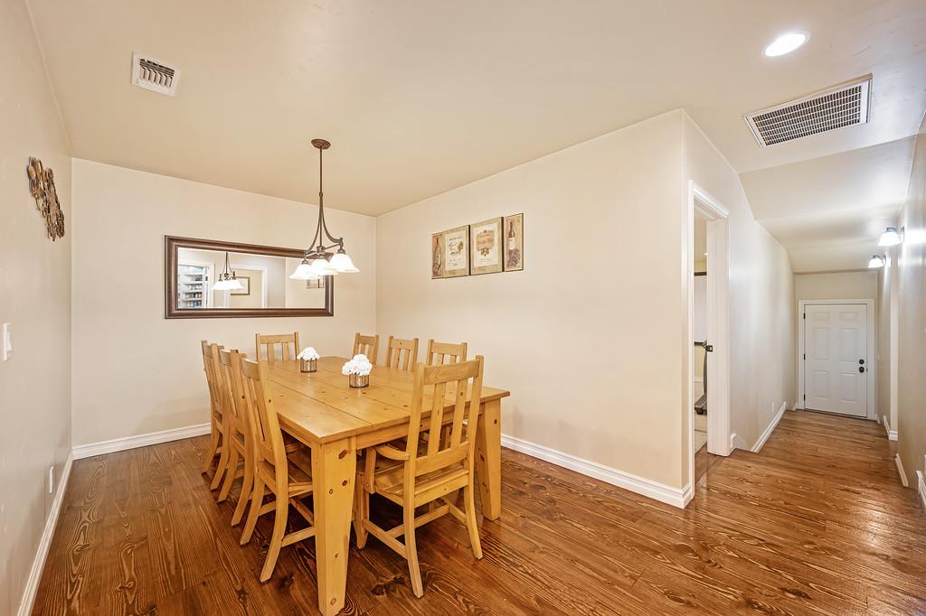 3557 Val Verde Road Loomis, CA 95650 - Photo 20 of 71 a view of a dining room with furniture and wooden floor