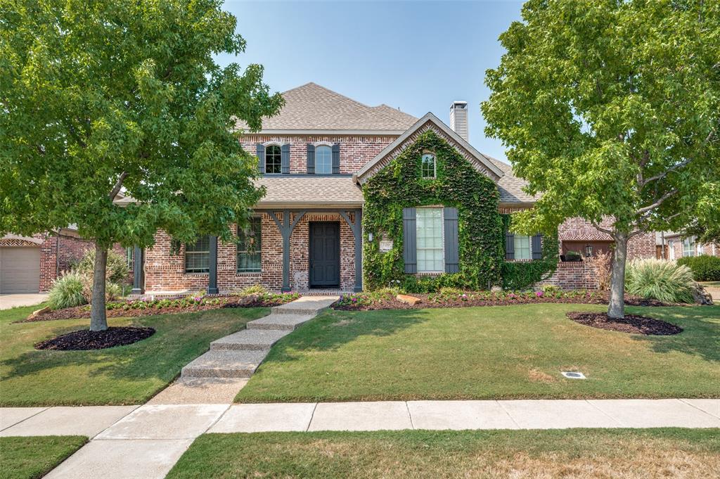 720 Hunters Place Prosper, TX 75078 - Photo 1 of 1 a front view of a house with a yard and porch
