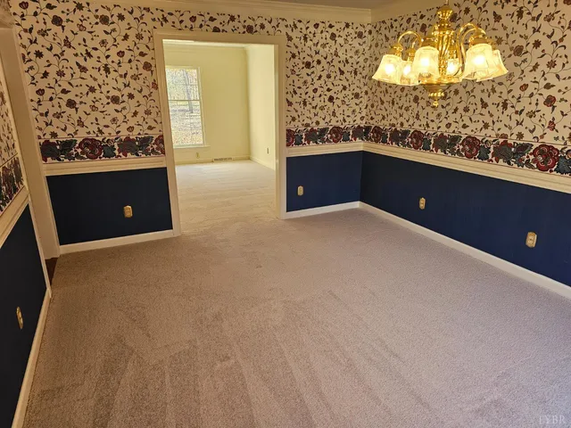 a bathroom with a granite countertop sink toilet and a mirror