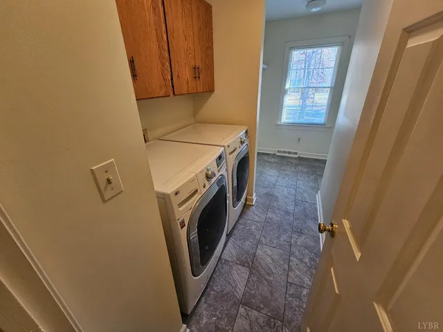 an aerial view of a house with a yard and balcony