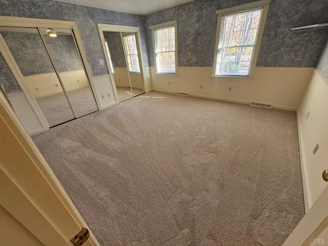 a view of house with swimming pool outdoor seating