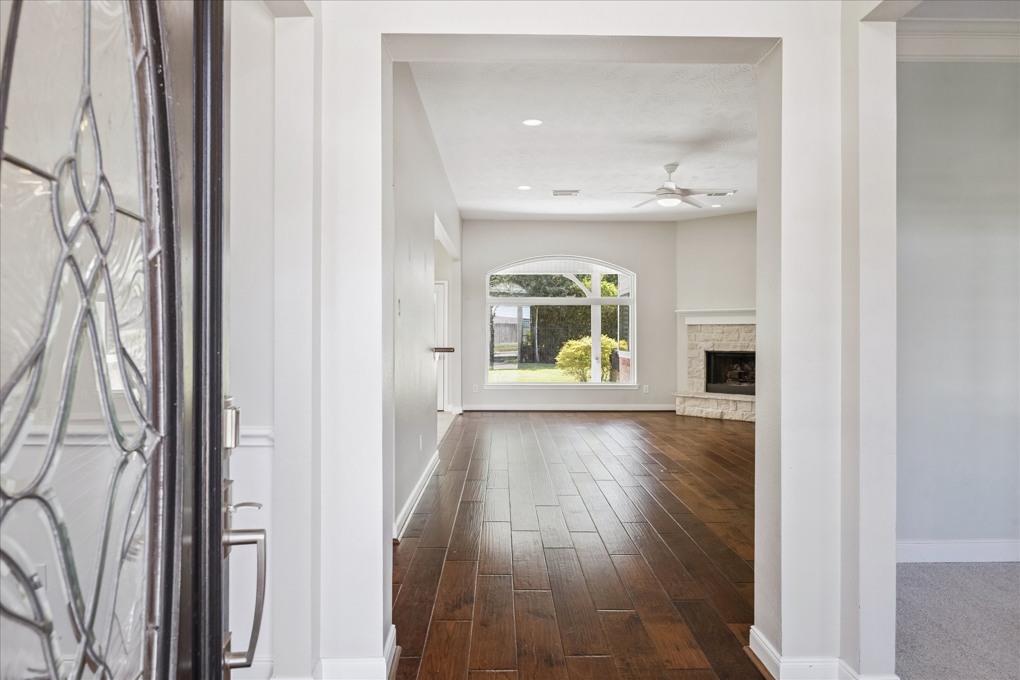 12015 Wynmar Lane Cypress, TX 77429 - Photo 2 of 13 a view of an entryway with wooden floor and a window