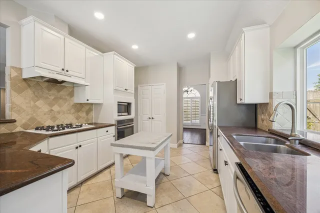 a view of kitchen with furniture and window