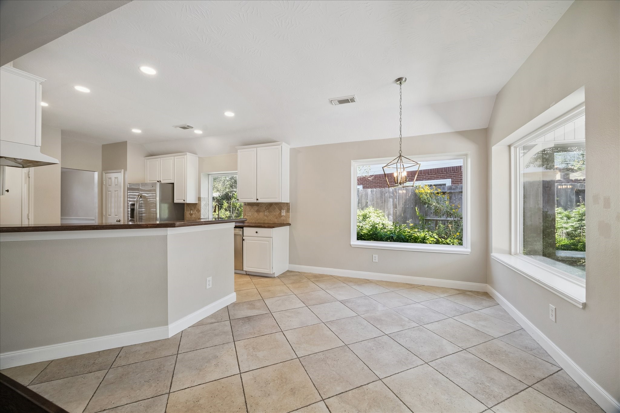 12015 Wynmar Lane Cypress, TX 77429 - Photo 7 of 13 a view of kitchen with furniture and window