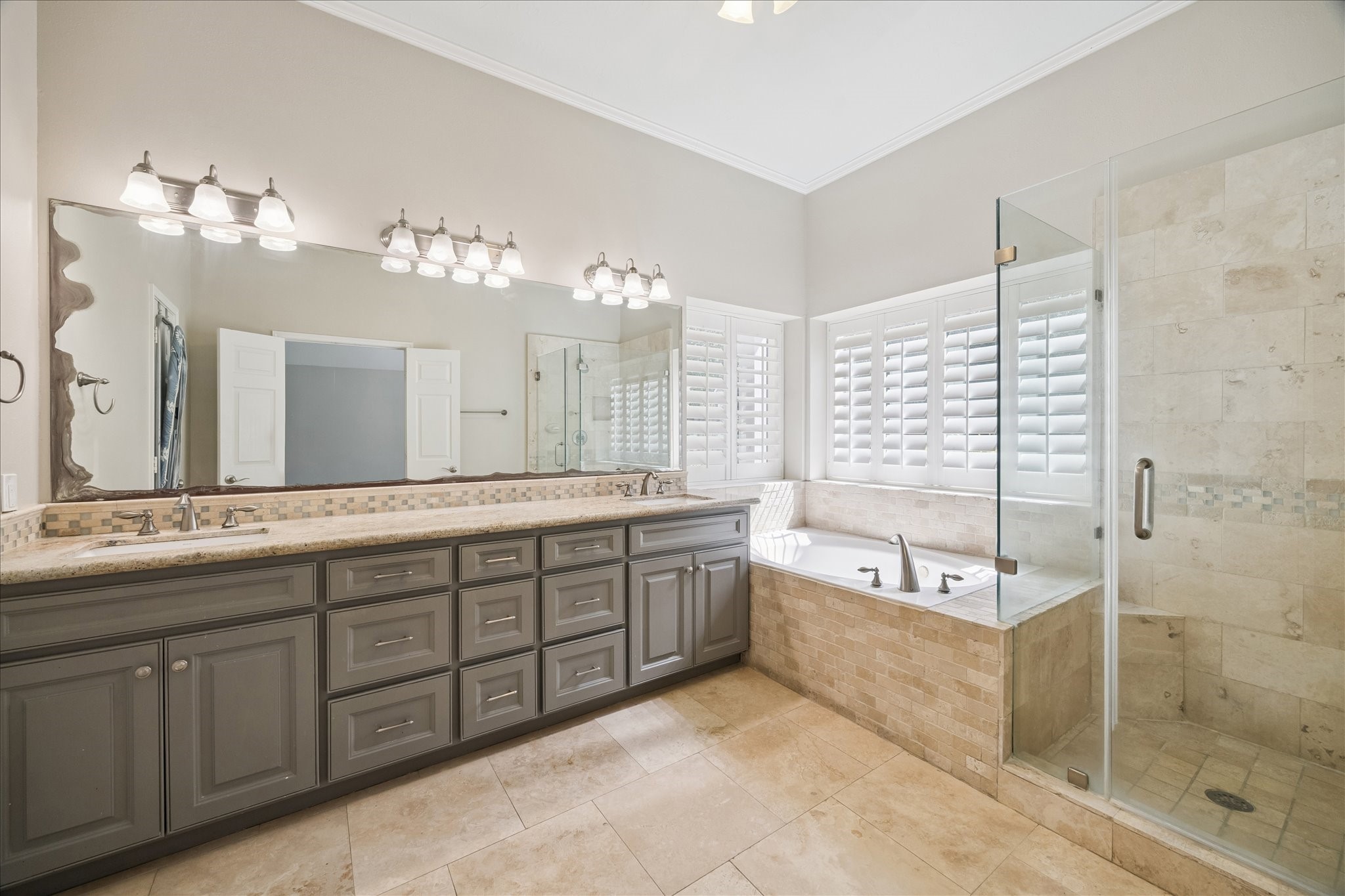 12015 Wynmar Lane Cypress, TX 77429 - Photo 9 of 13 a spacious bathroom with a double vanity sink mirror and bathtub