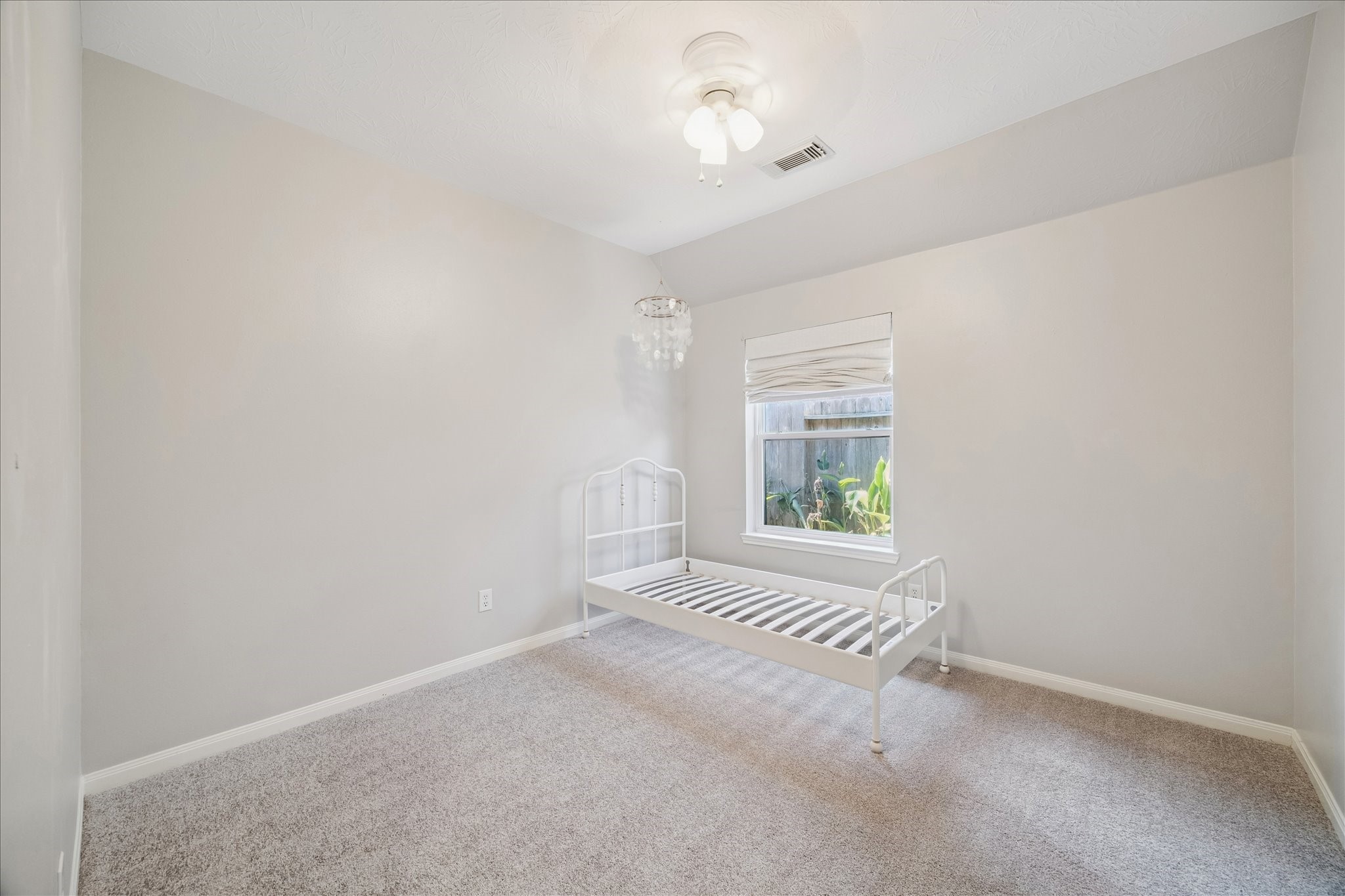 12015 Wynmar Lane Cypress, TX 77429 - Photo 10 of 13 a view of an empty room with a window