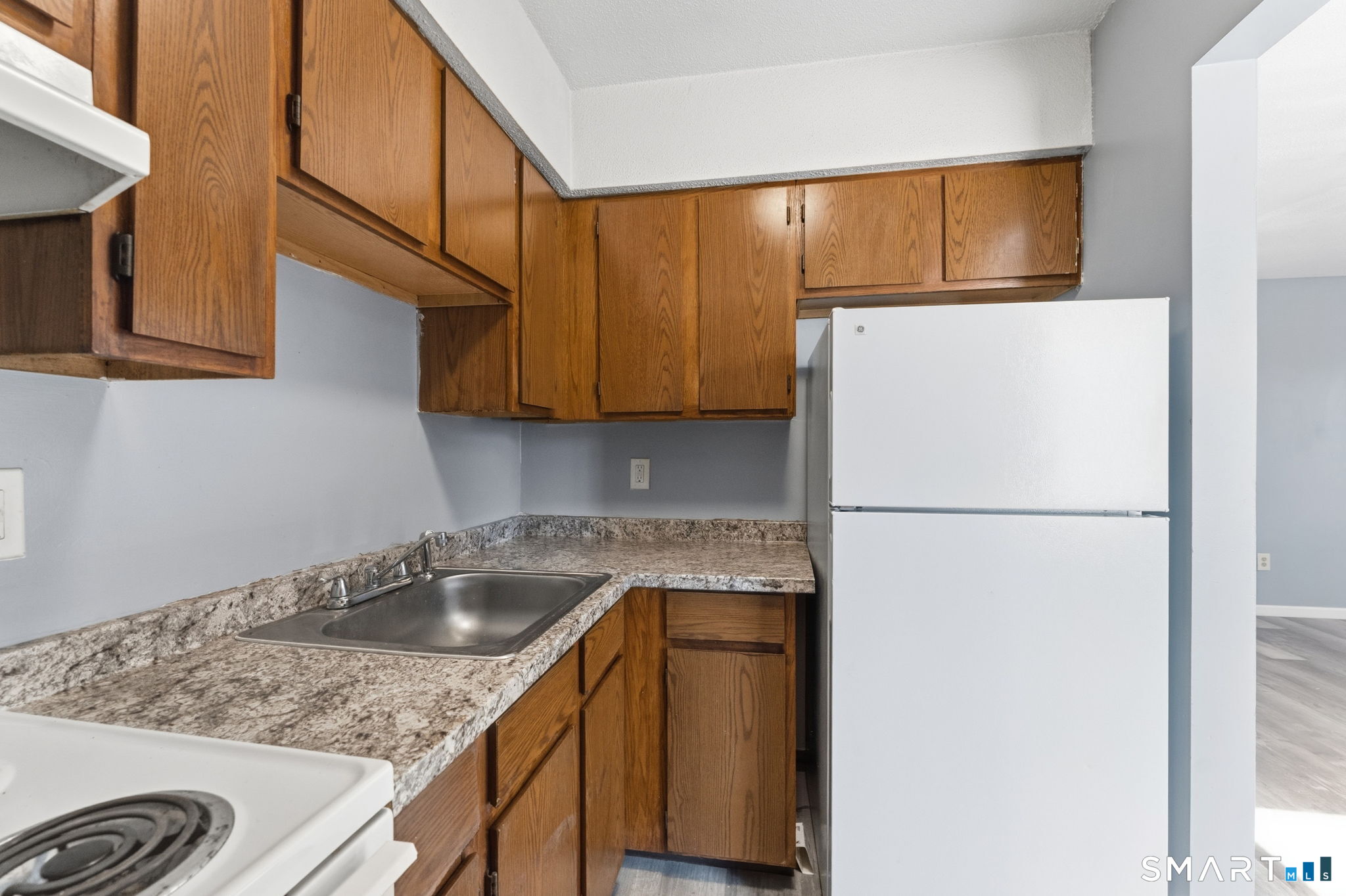 5-7 Warner St Extension, Unit 5B Hartford, CT 06114 - Photo 6 of 17 a kitchen with a sink cabinets and refrigerator