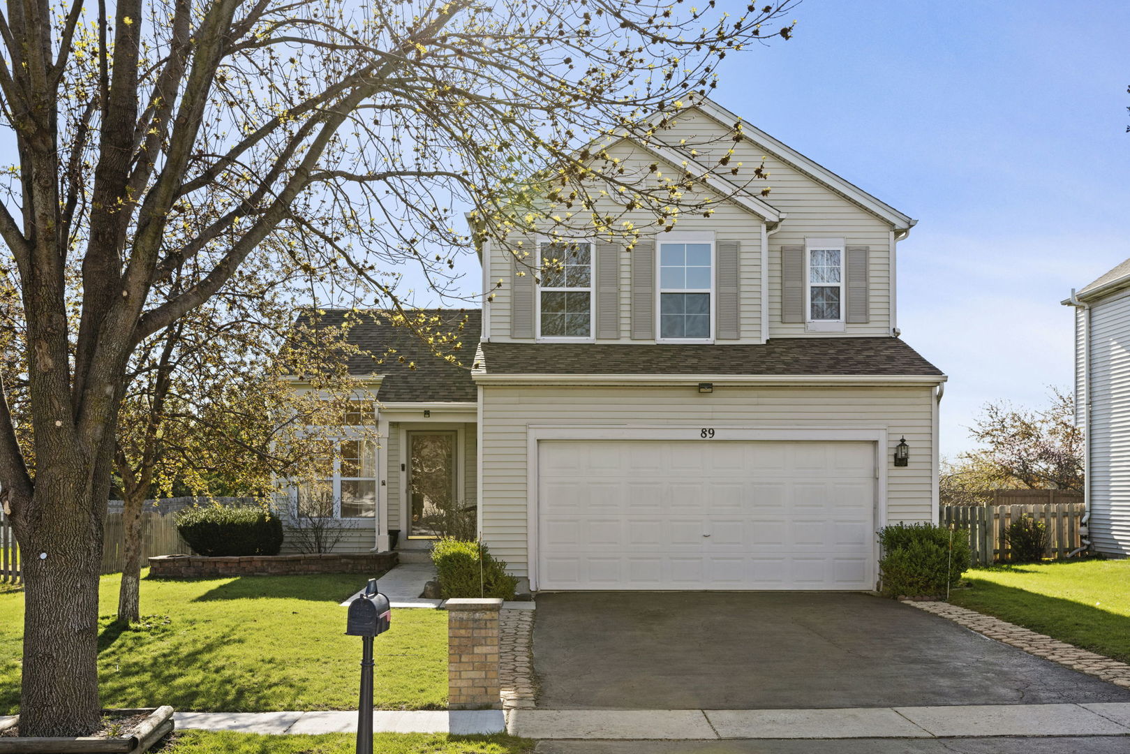 front view of a house with a yard
