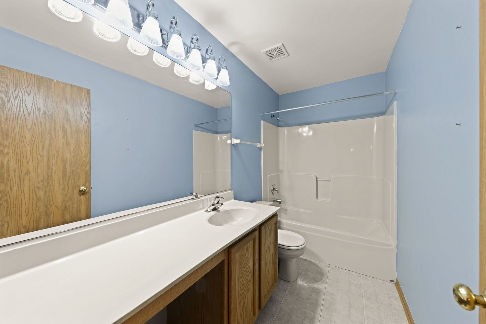 89 Iris Circle Romeoville, IL 60446 - Photo 13 of 28 a bathroom with a sink a toilet and a mirror