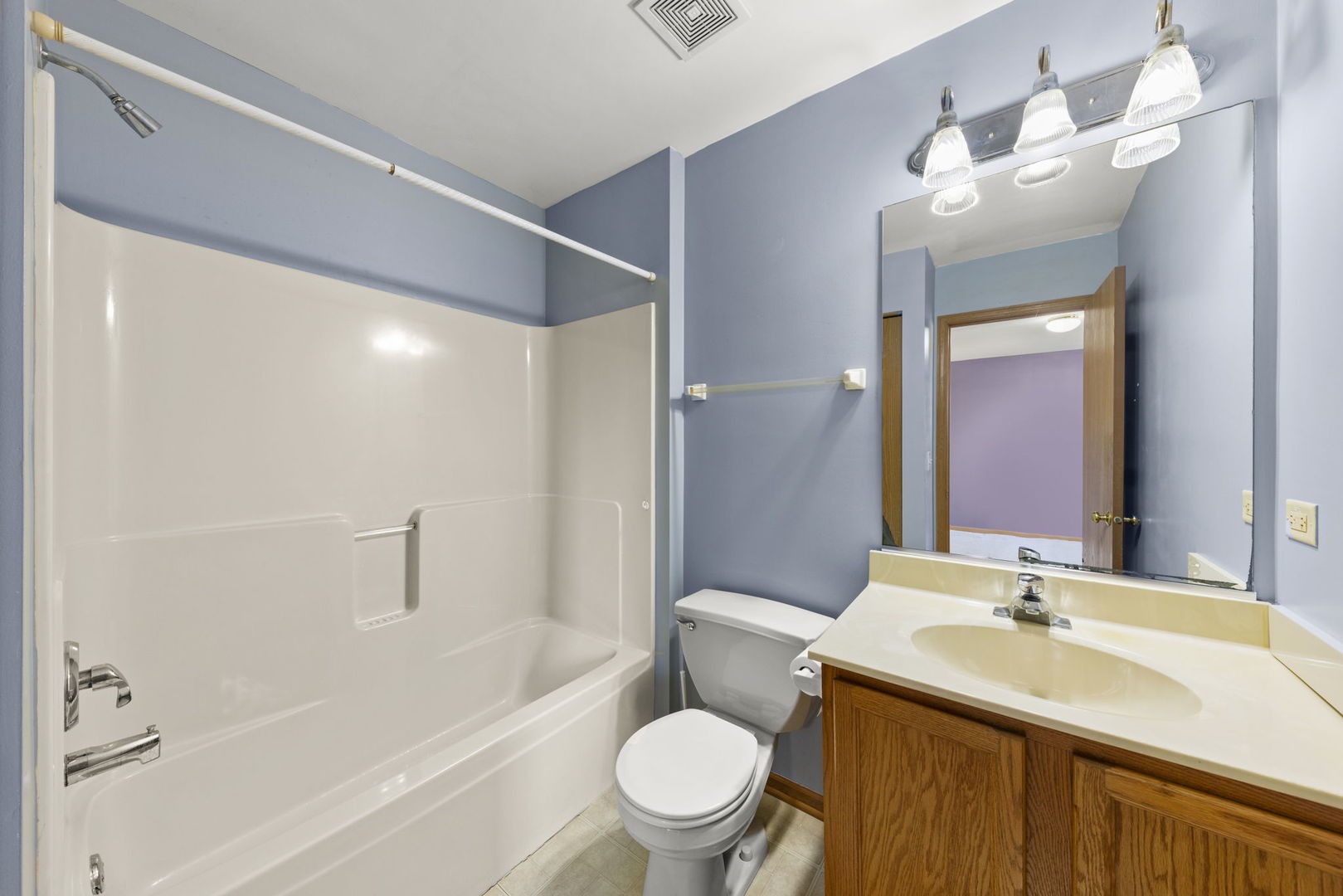 89 Iris Circle Romeoville, IL 60446 - Photo 16 of 28 a bathroom with a sink a toilet and shower