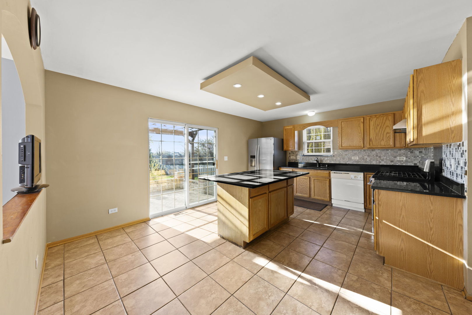 89 Iris Circle Romeoville, IL 60446 - Photo 4 of 28 a large kitchen with stainless steel appliances granite countertop a sink and cabinets