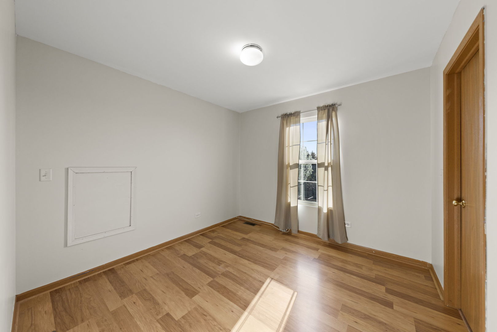 89 Iris Circle Romeoville, IL 60446 - Photo 10 of 28 a view of empty room with wooden floor and fan
