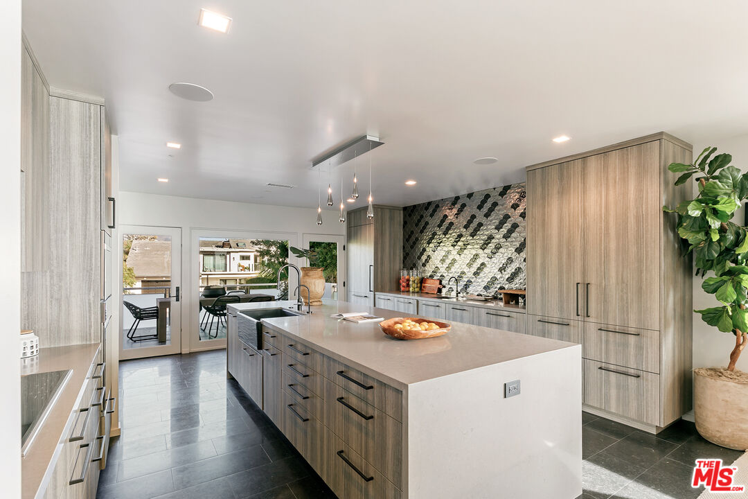 31558 Victoria Point Road Malibu, CA 90265 - Photo 24 of 55 a kitchen with a sink appliances and cabinets