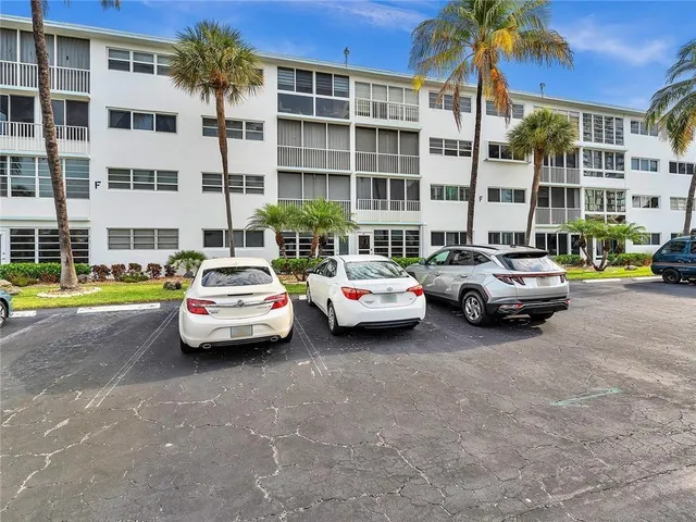 a view of a cars parked in front of a building