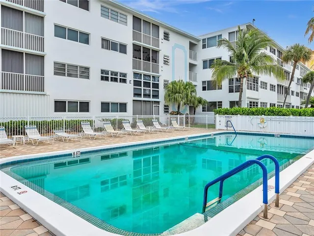 a view of swimming pool with outdoor seating