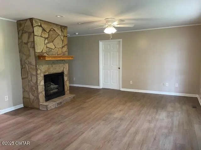 a kitchen with granite countertop a stove a sink and a cabinets