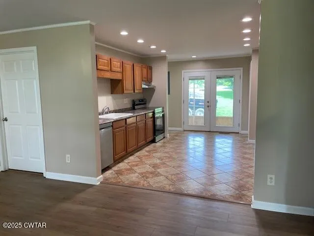 a view of a room with a table and chairs