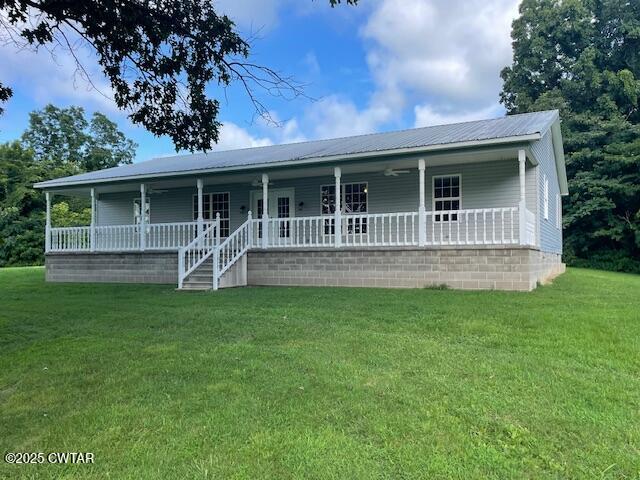 874 Key Road Troy, TN 38260 - Photo 2 of 48 a front view of house with a garden