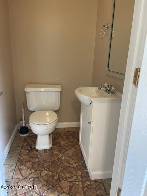 874 Key Road Troy, TN 38260 - Photo 28 of 48 a bathroom with a toilet and a sink