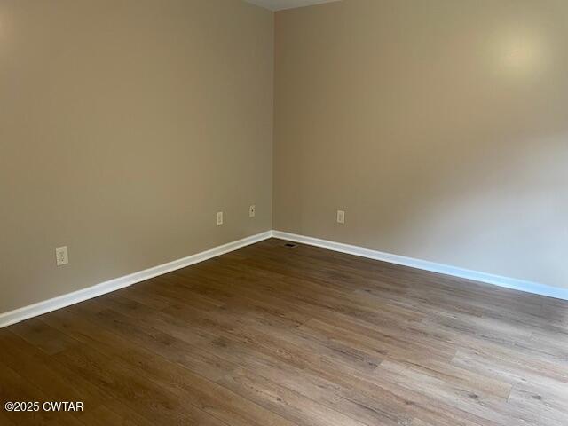 874 Key Road Troy, TN 38260 - Photo 29 of 48 a view of an empty room with wooden floor