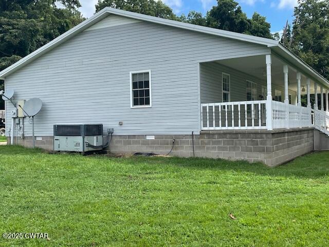 874 Key Road Troy, TN 38260 - Photo 3 of 48 a view of a house with a yard and a garden