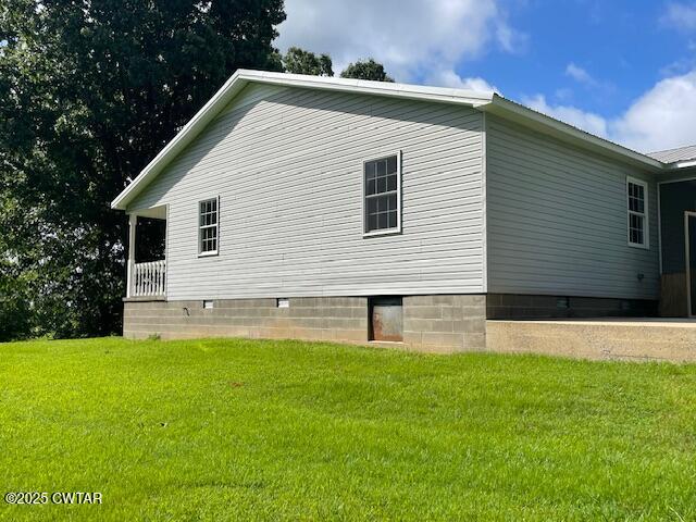 874 Key Road Troy, TN 38260 - Photo 7 of 48 a front view of a house with a yard and garage