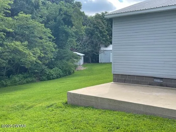 a view of a backyard with a garden