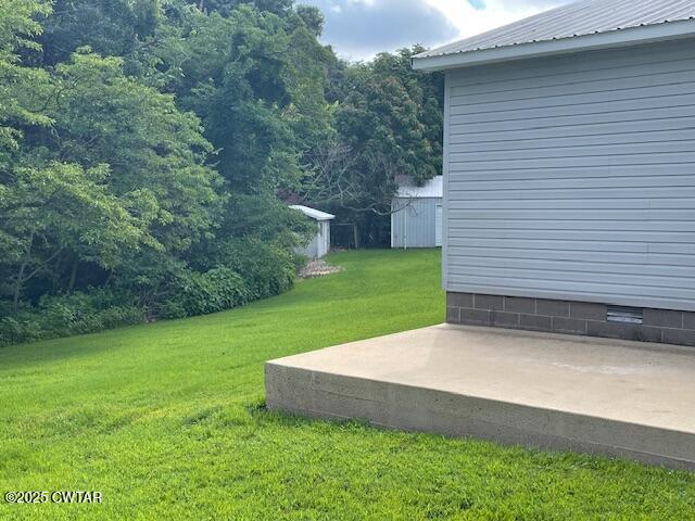 874 Key Road Troy, TN 38260 - Photo 8 of 48 a view of a backyard with a garden