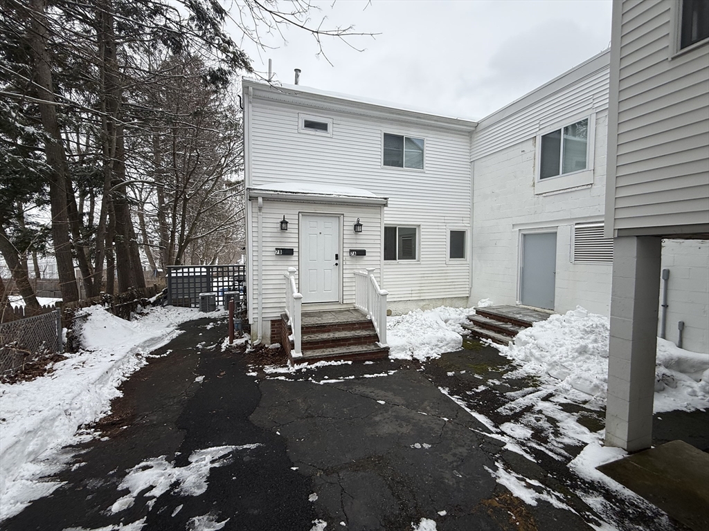 7 Williston Road, Unit A Belmont, MA 02478 - Photo 1 of 10 a front view of a house with a sitting area