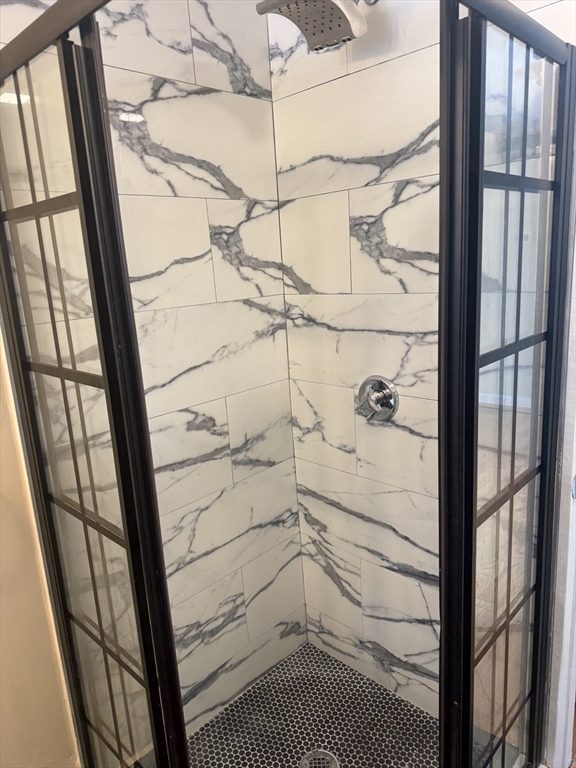 7 Williston Road, Unit A Belmont, MA 02478 - Photo 5 of 10 a bathroom with a shower