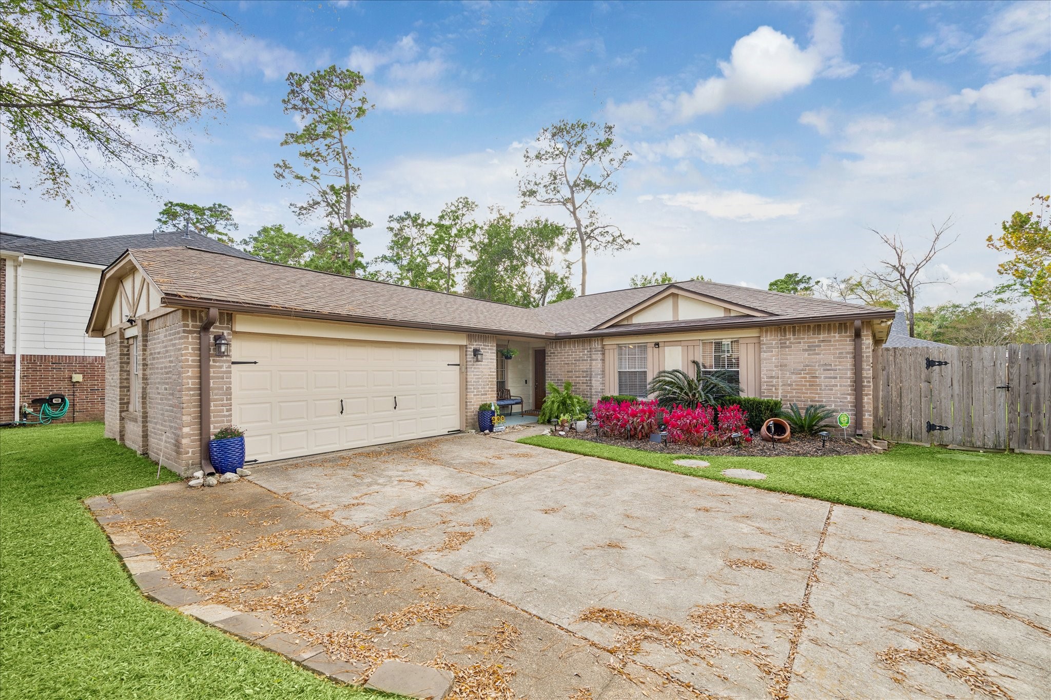 a view of a house with a yard and garage